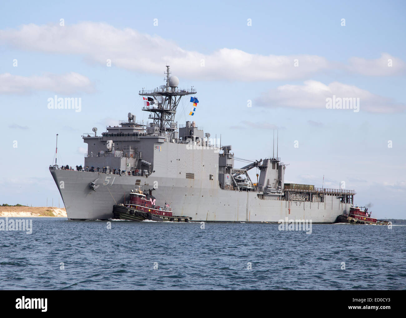 The USS Oak Hill being escorted to dock. Stock Photo