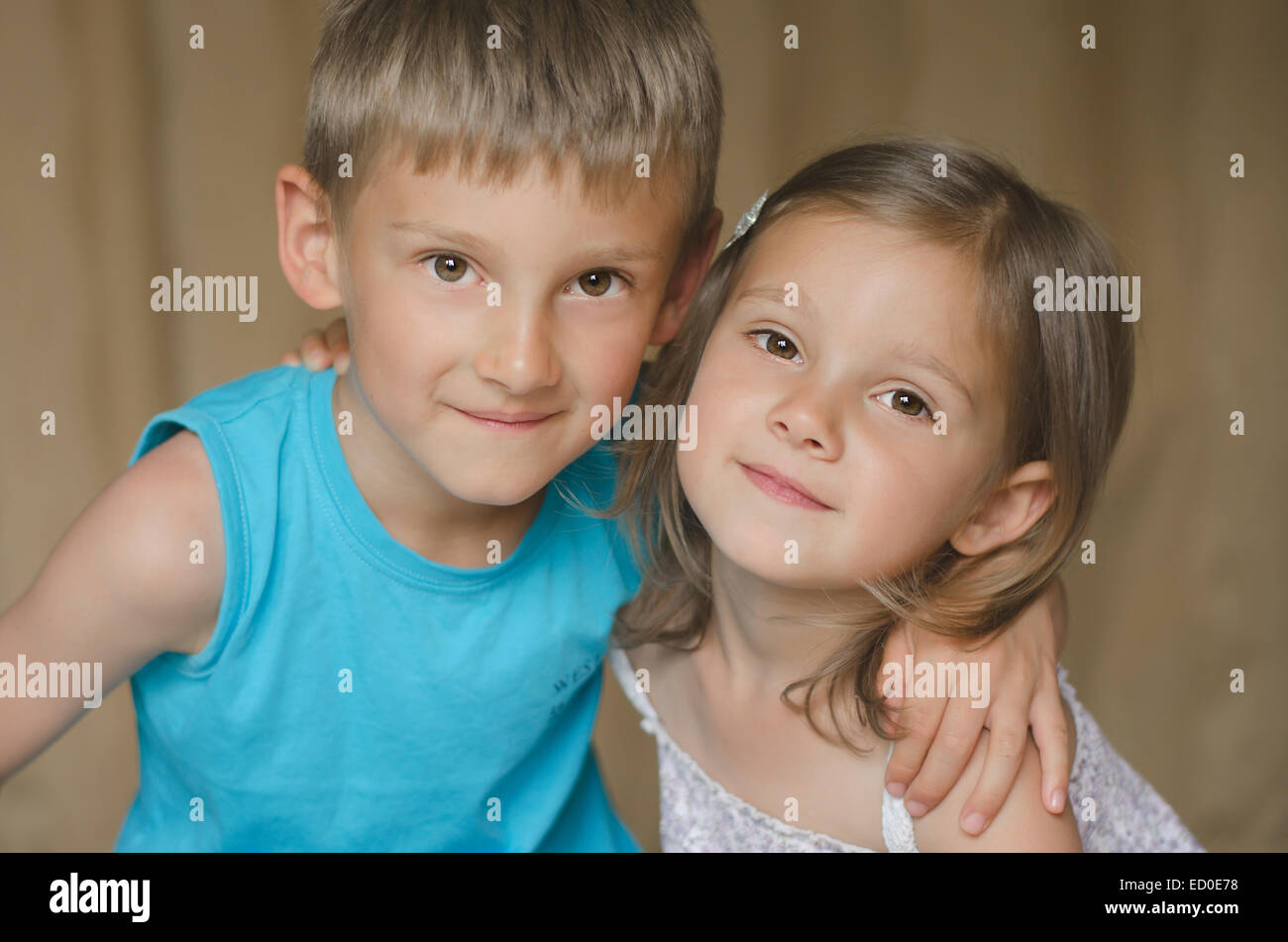Portrait of brother and sister smiling Stock Photo