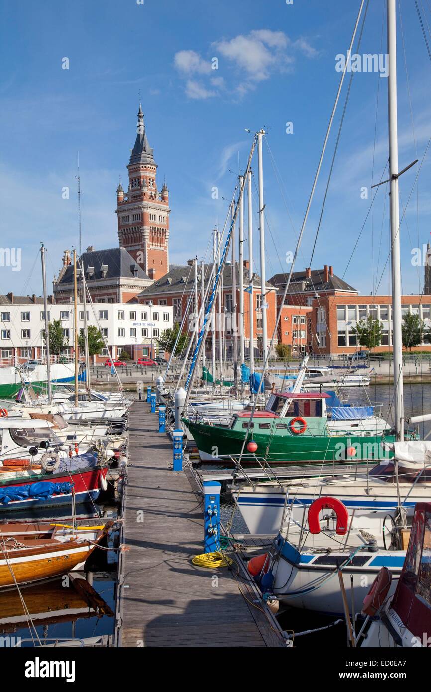France, Nord, Dunkirk, boats in the marina and city hall belfry listed as World Heritage by UNESCO Stock Photo