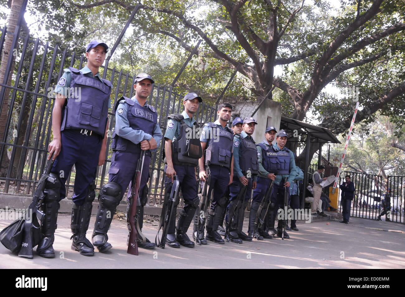 Dhaka, Bangladesh. 23rd Dec, 2014. Bangladeshi police stand guard in front of the Supreme Court during a verdict announcement in Dhaka, Bangladesh, Dec. 23, 2014. Bangladesh's International Crimes Tribunal (ICT)-1 found the former Minister Syed Mohammed Kaiser guilty of collaborating with Pakistani forces and committing war crimes including mass killings during the country's Liberation War in 1971, and has sentenced him to death. Credit:  Shariful Islam/Xinhua/Alamy Live News Stock Photo