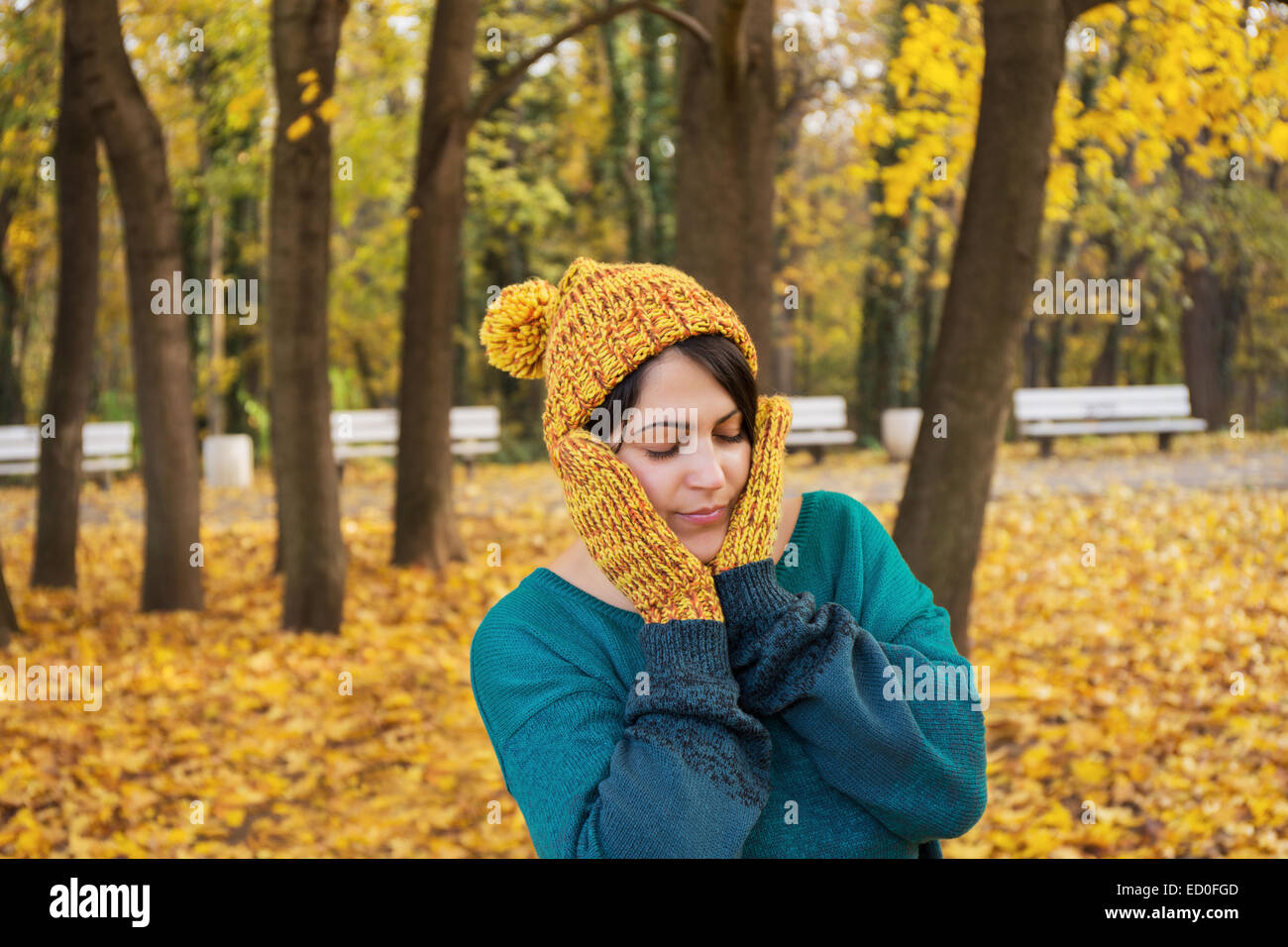 Portrait of woman in park Stock Photo - Alamy