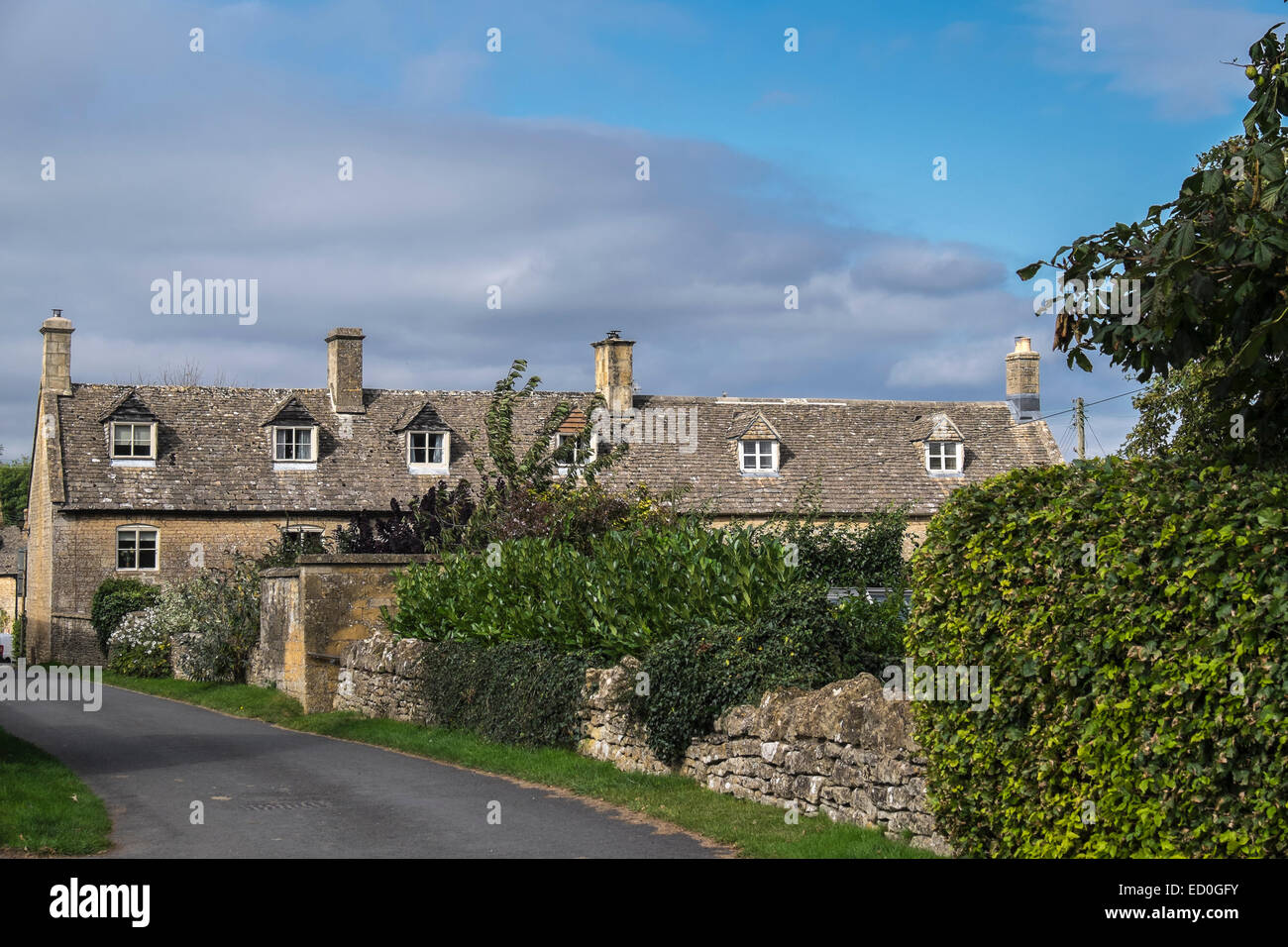 Dormer windows in Cotswold cottage roofs Guiting Power The Cotswolds Gloucestershire England Stock Photo
