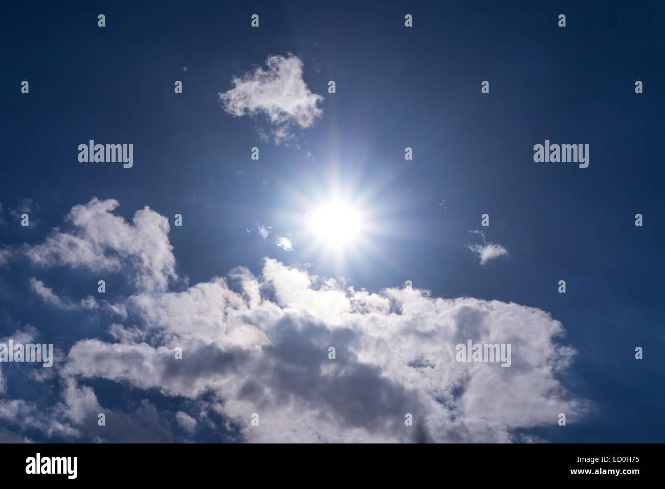 sun and cloudy sky in summer time Stock Photo