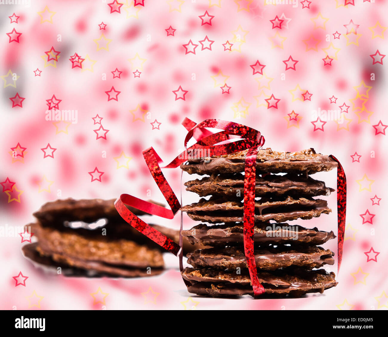 Chocolate cookies with red ribbon and stars background Stock Photo - Alamy
