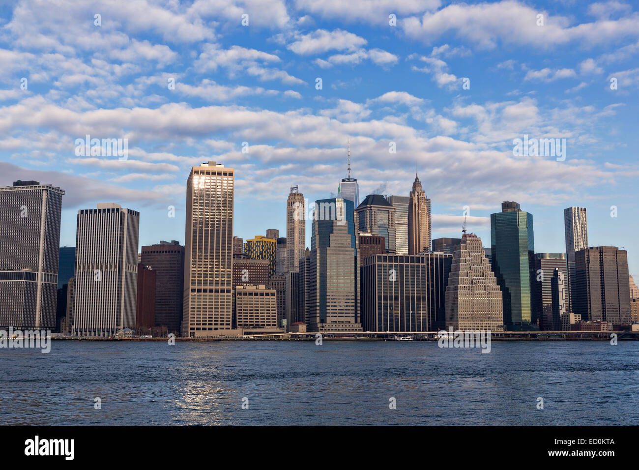 Lower Manhattan skyline viewed from the Brooklyn Bridge park across the East River December 17, 2014 in Brooklyn, NY. Stock Photo