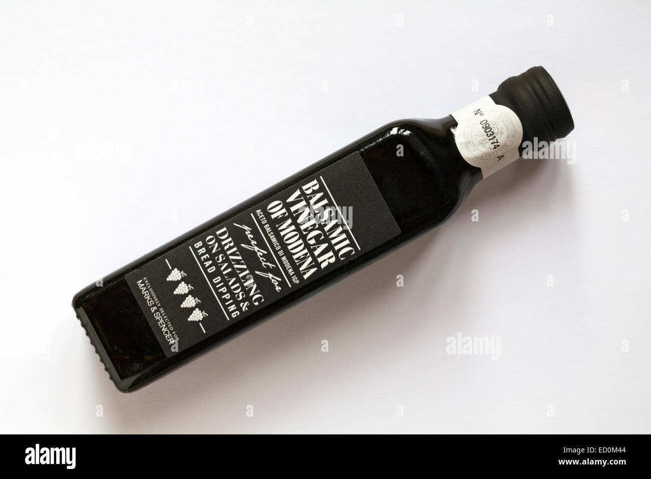 Bottle of Balsamic Vinegar of Modena perfect for drizzling on salads & bread dipping isolated on white background Stock Photo