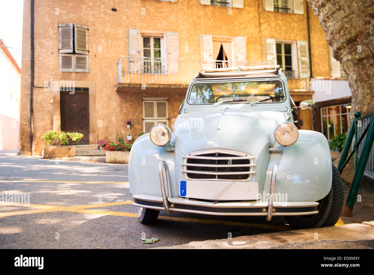 Romantic square with typical lavender blue French car Stock Photo