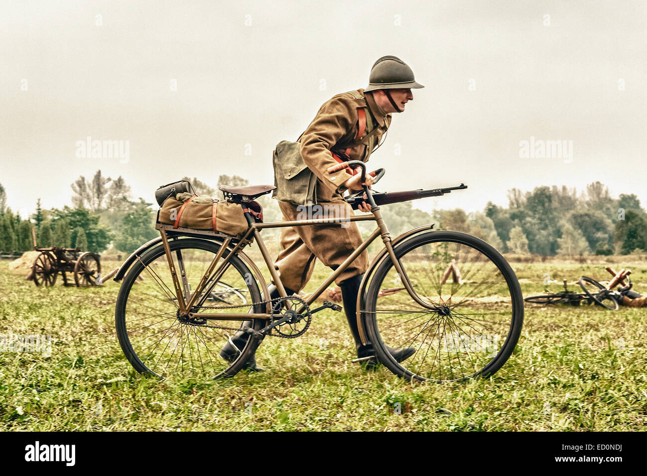 Polish soldier with bicycle during WWII Battle of Lomianki - historical reenactment, Poland Stock Photo