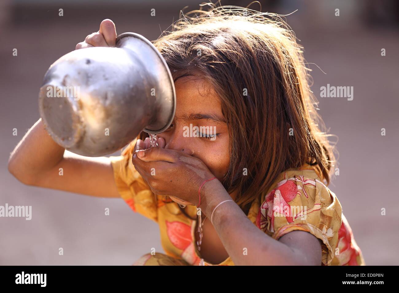 Indian girl drinking water India Stock Photo