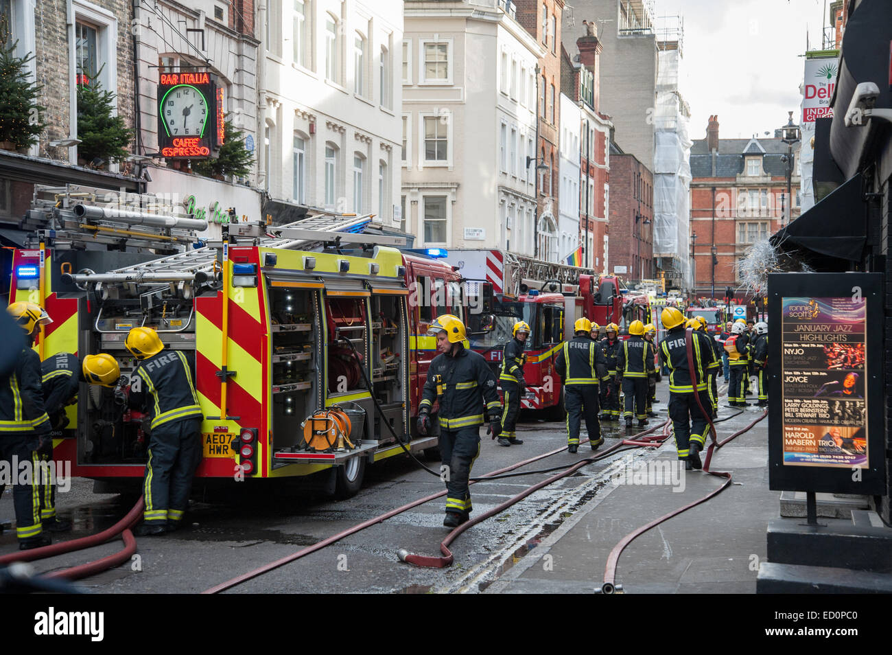 London, UK. 23 December, 2014. Six fire engines and 35 Firefighters dealing with a fire at the Delhi Patisserie, an Indian Restaurant next to Ronnie Scotts in Soho's Frith Street. Credit:  Pete Maclaine/Alamy Live News Stock Photo