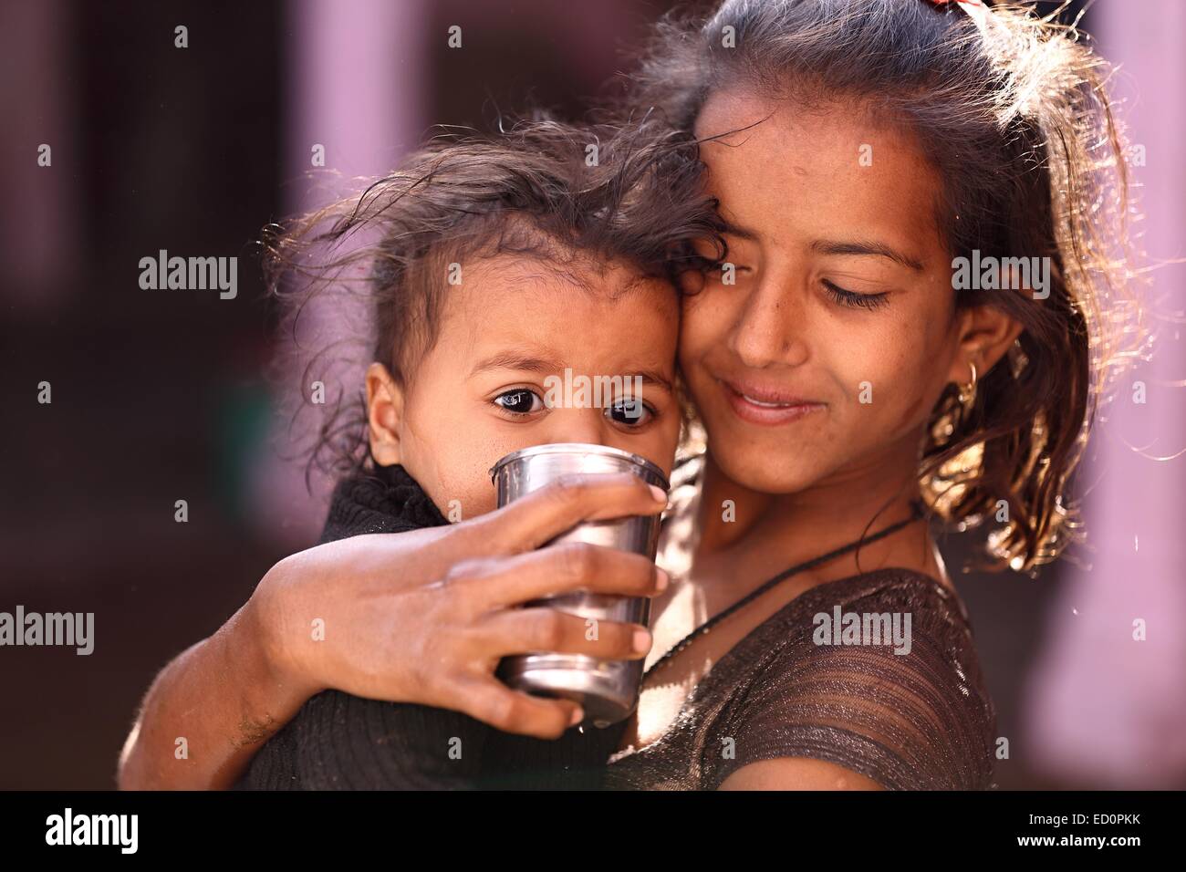 Indian girls drinking water India Stock Photo