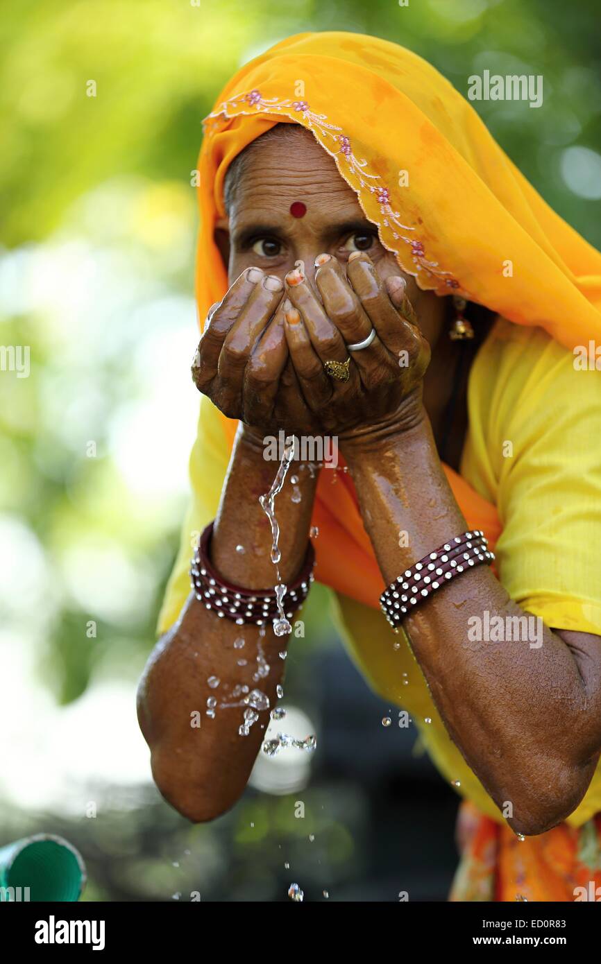 Indian woman drinking water India Stock Photo