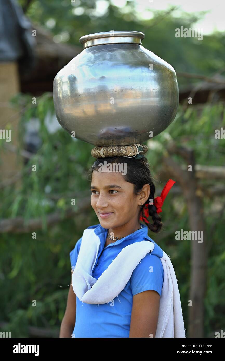 Indian girl carrying a pot of fresh water India Stock Photo