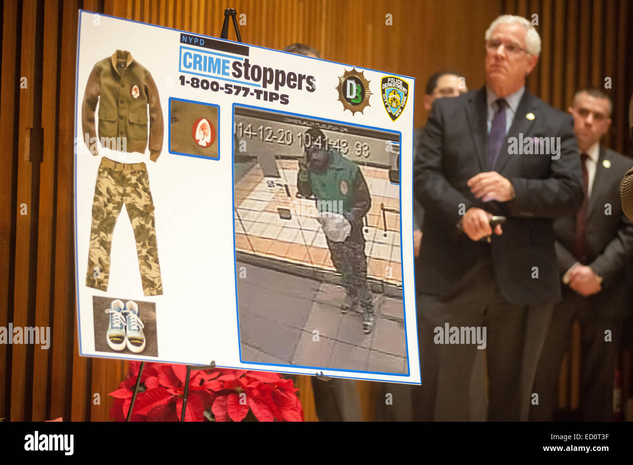 Crimestoppers poster at a media briefing in One Police Plaza the assassination of two NYPD officers, Wenjian Liu and Rafael Ramos by Ismaaiyl Brinsley.  The officers were murdered in Brooklyn in their squad car by Brinsley allegedly in retaliation for the Eric Garner death. Brinsley killed himself in the subway during his attempted escape. (© Richard B. Levine) Stock Photo