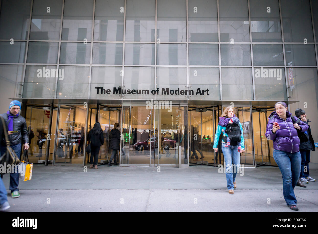 Visitors pass the entrance to the Museum of Modern Art in New York on Stock  Photo - Alamy