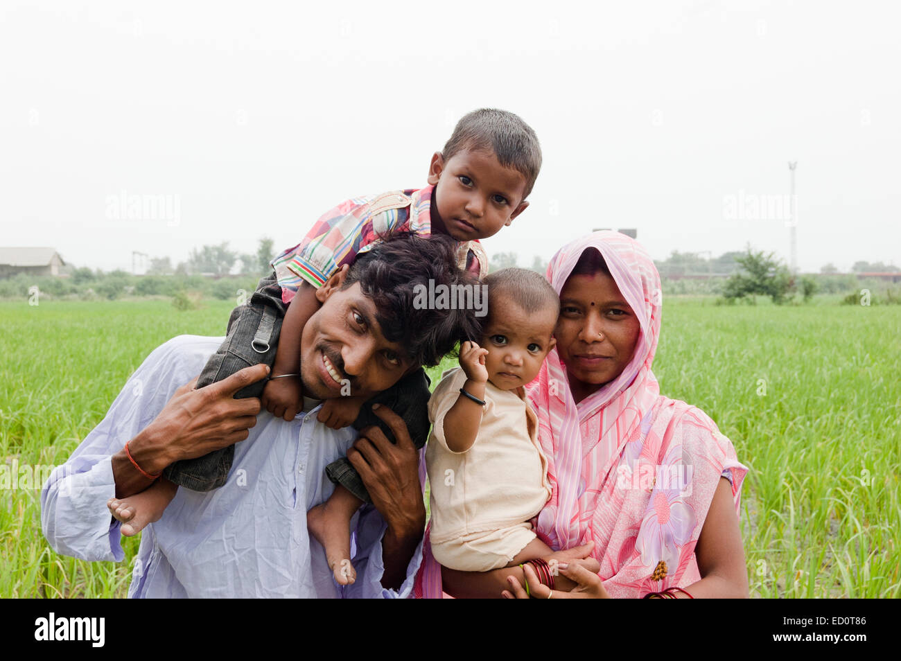 indian rural  Parents with child Field Stock Photo