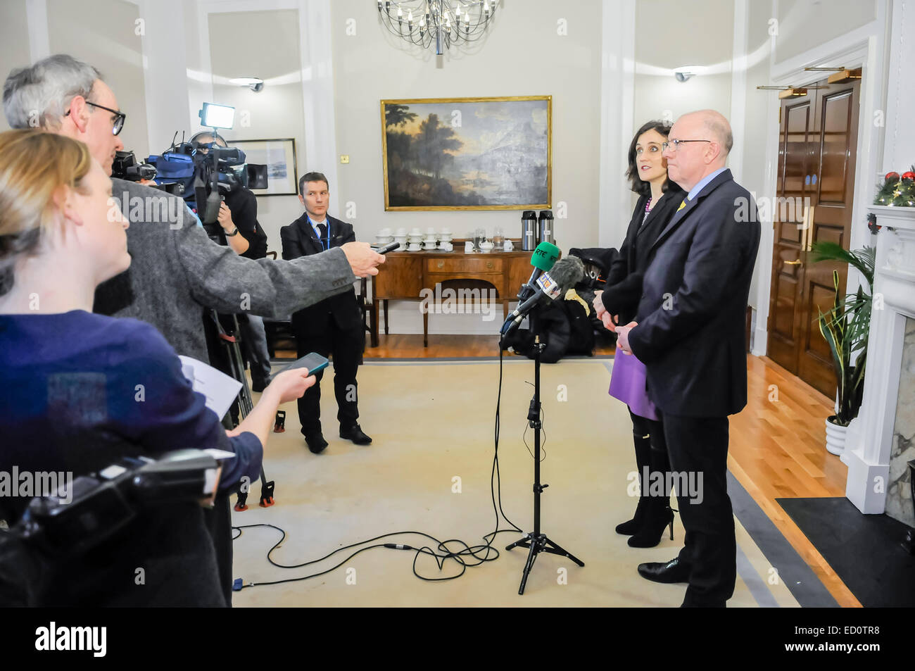 Belfast, Northern Ireland. 23 Dec 2014 - Secretary of State for Northern Ireland, Theresa Villiers, and the Irish Minister For Foreign Affairs Charles Flanaghan, who helped broker an agreement between the Northern Ireland executive parties, and the British and Irish Governments Credit:  Stephen Barnes/Alamy Live News Stock Photo