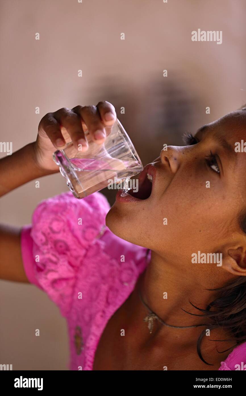 Indian girl drinking water India Stock Photo