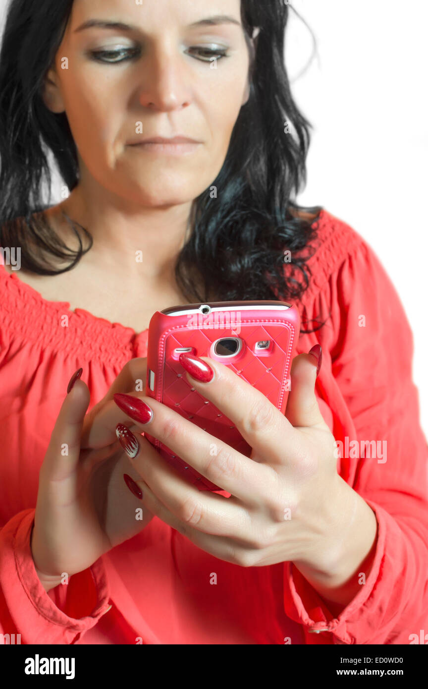 Beautiful woman touching and browsing her smart phone. Stock Photo