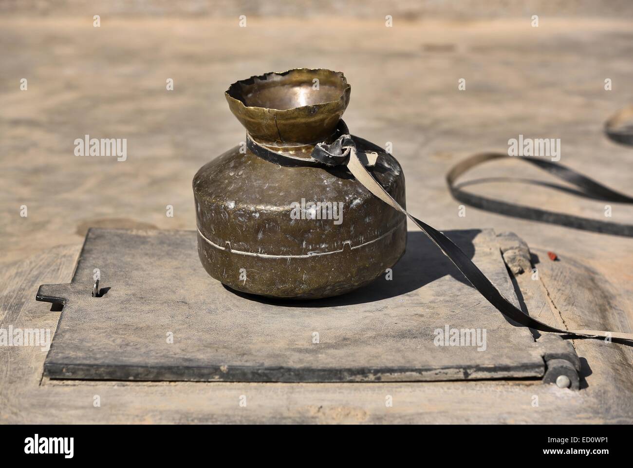 pot to extract water from a rain water harvesting tank India Stock Photo