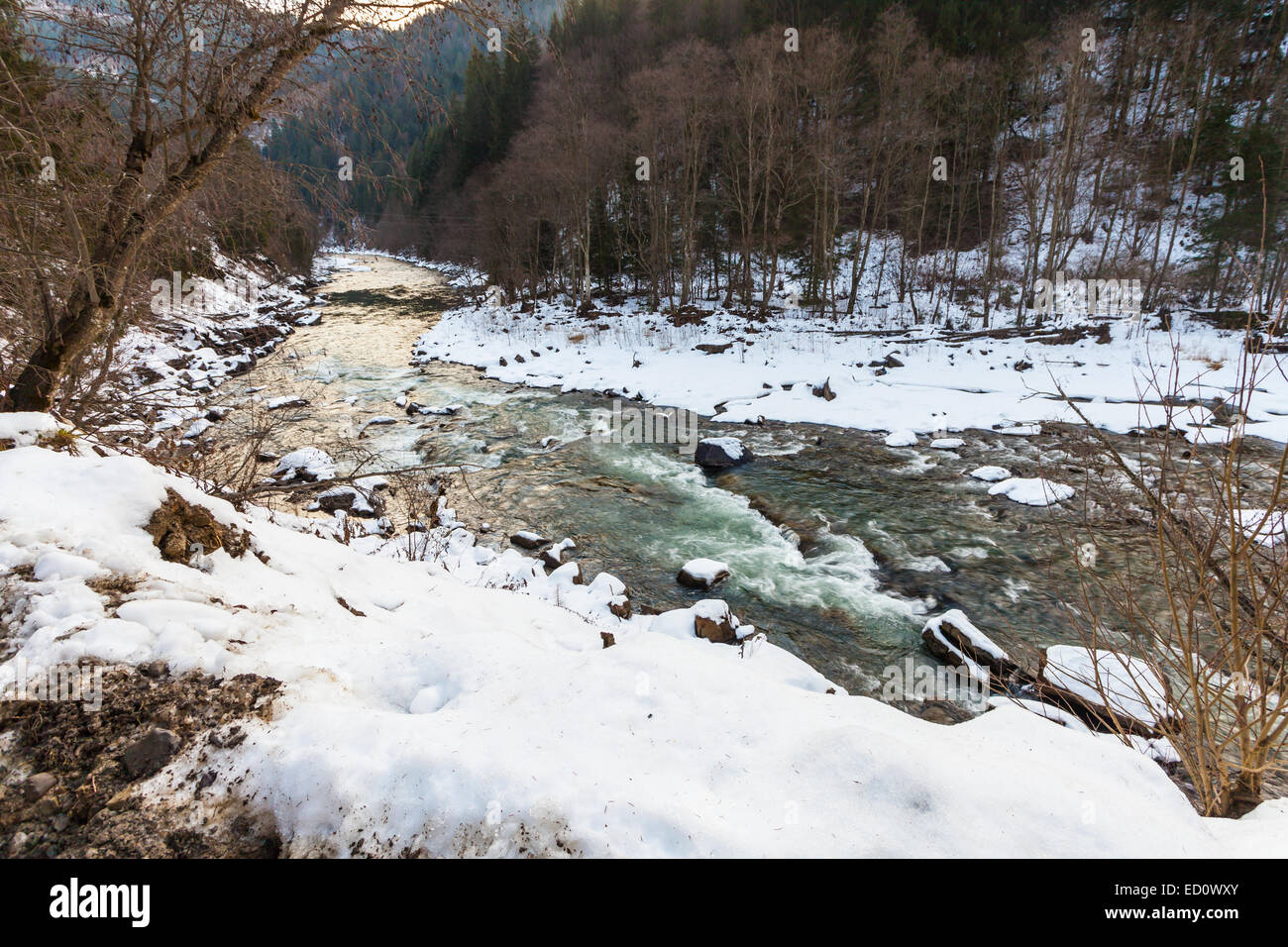 Bridge snow wood flowing river hi-res stock photography and images - Alamy