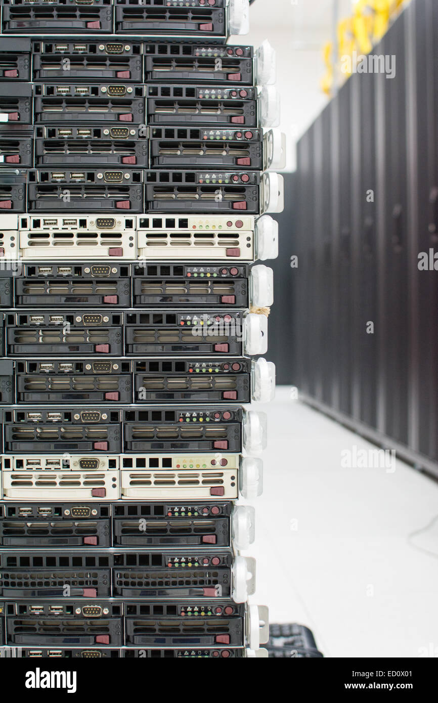 Stack of servers. Multiple servers on top of each other in a datacenter. Stock Photo