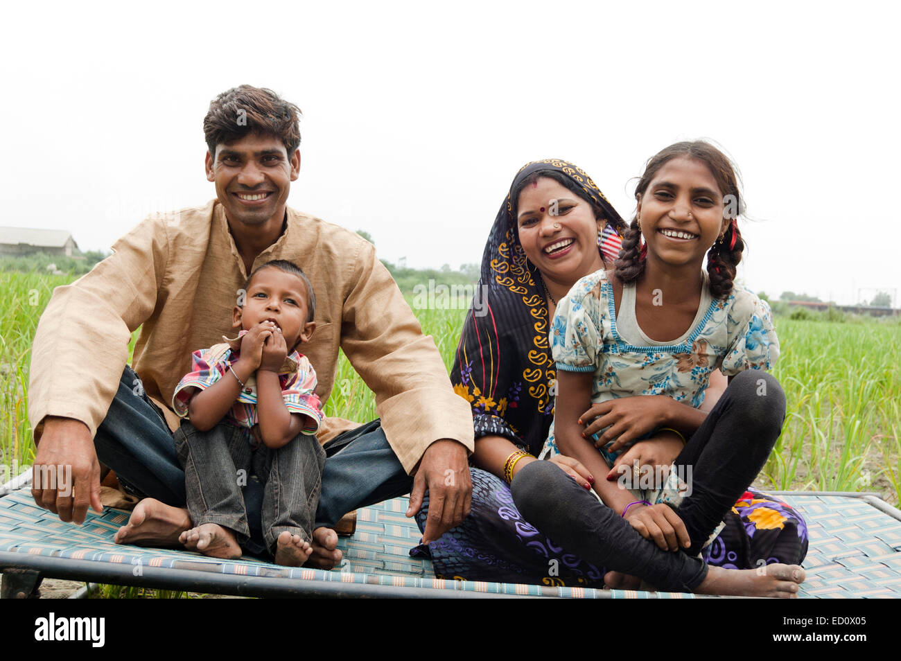 indian rural  Parents with child Field enjoy Stock Photo
