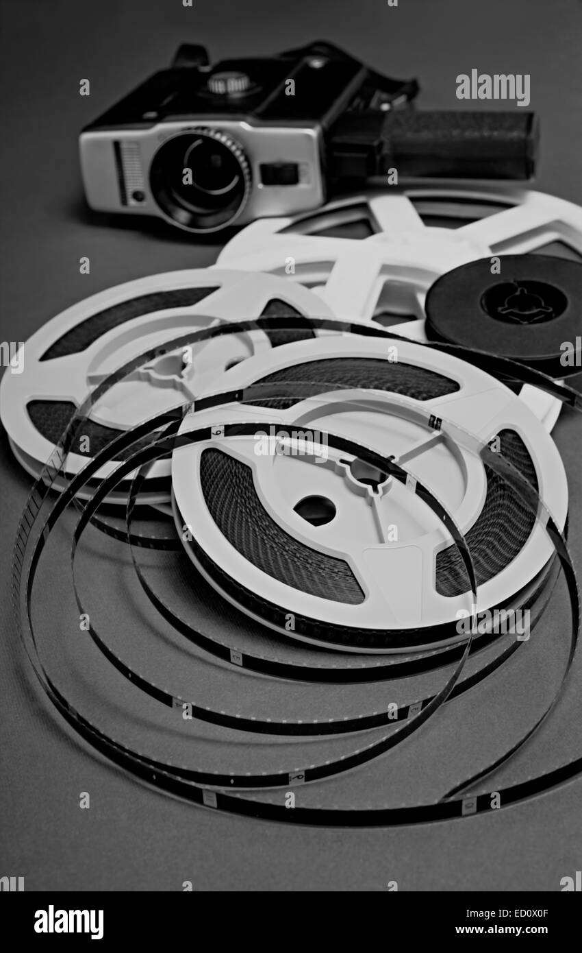 Still life of 8mm cine film reels and old movie camera. Shallow depth of field. Stock Photo