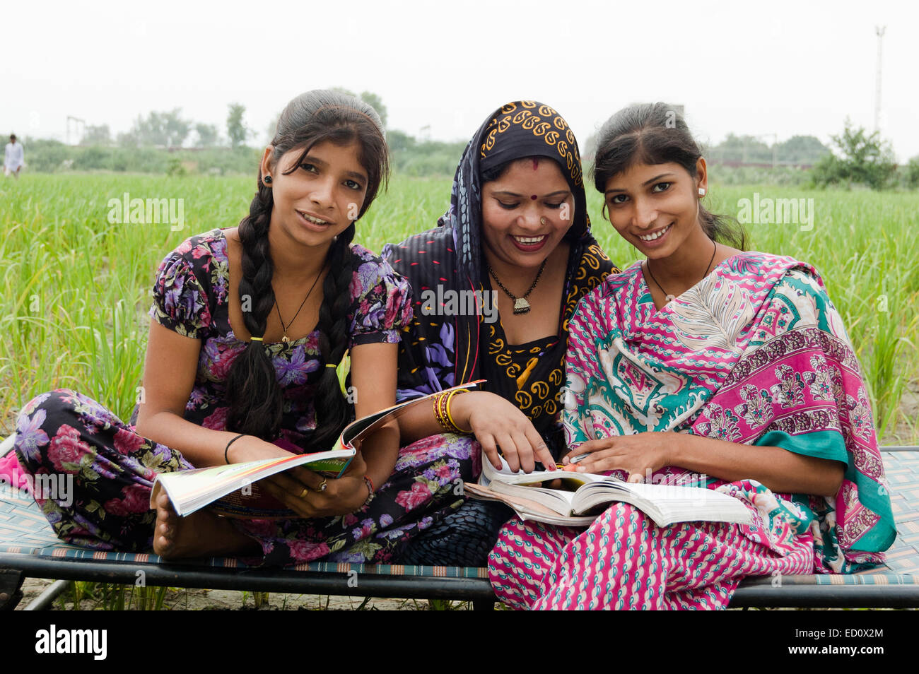 indian rural mother and  Daughter study Stock Photo