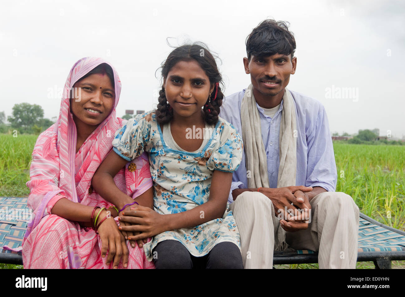 indian rural Parents and child sitting farm Stock Photo - Alamy
