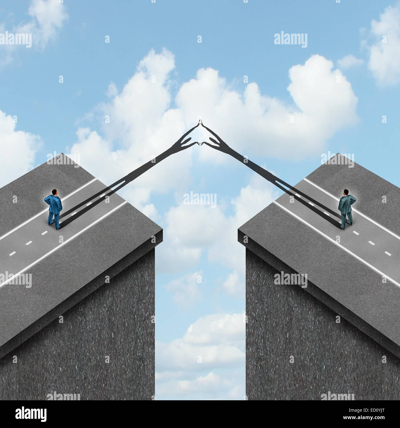 Business solution concept as a metaphor to overcome problems as bridging the gap between two financial partners as cast shadows Stock Photo