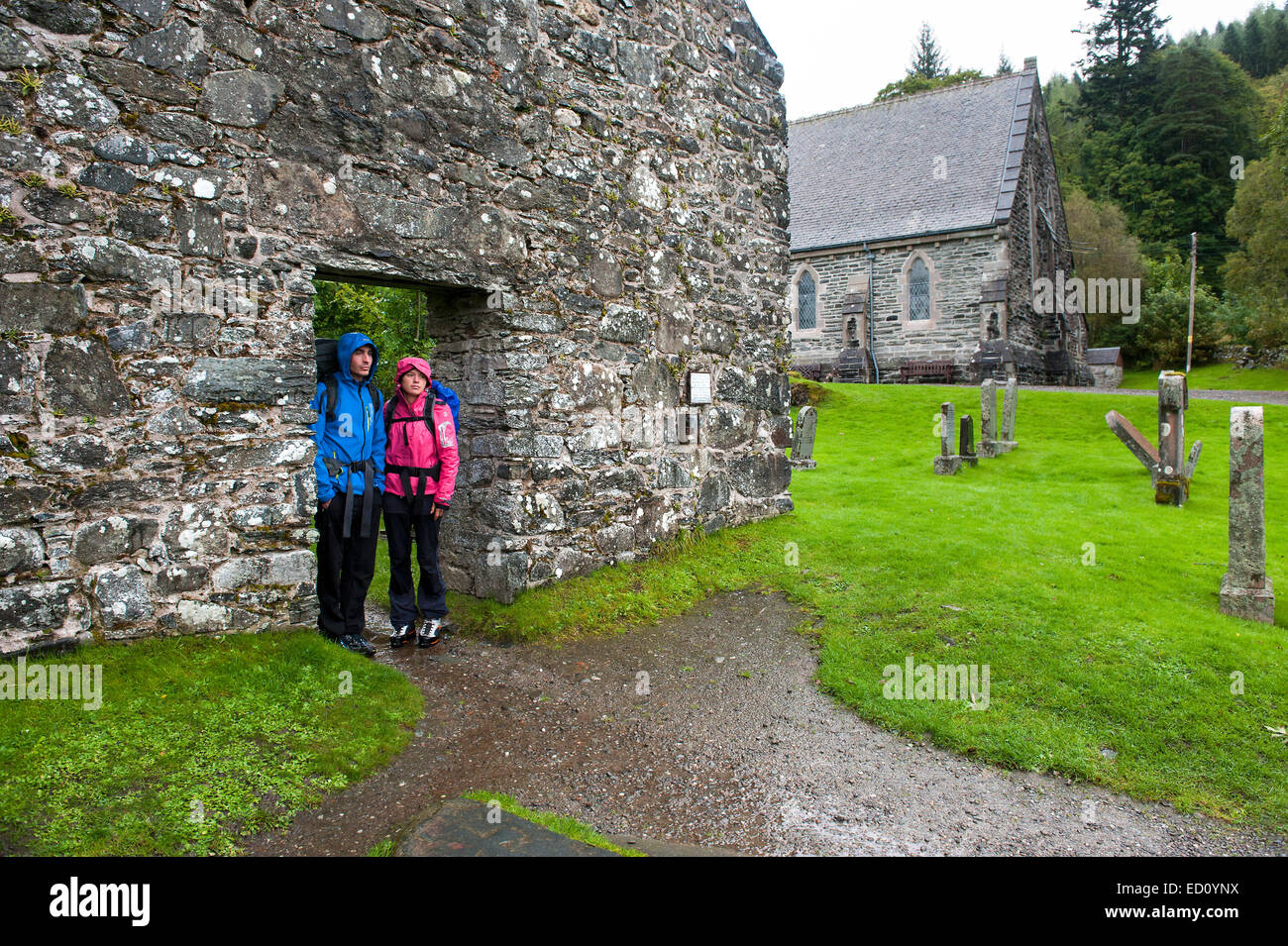 Hikers sheltering from the rain in Scotland Stock Photo