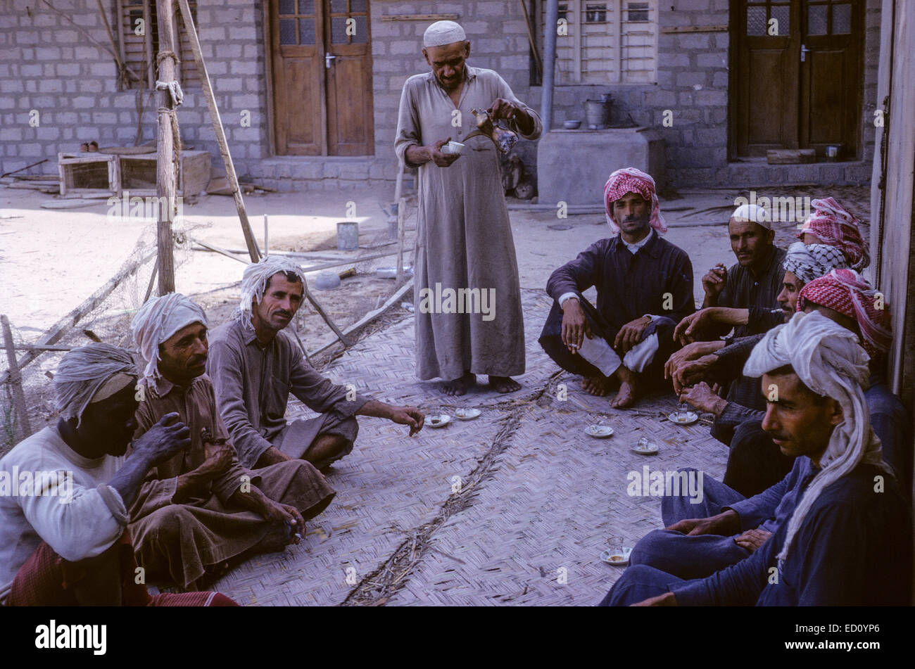 Kuwait April 1967.  Dhow Construction Workers Taking a Coffee Break. Stock Photo