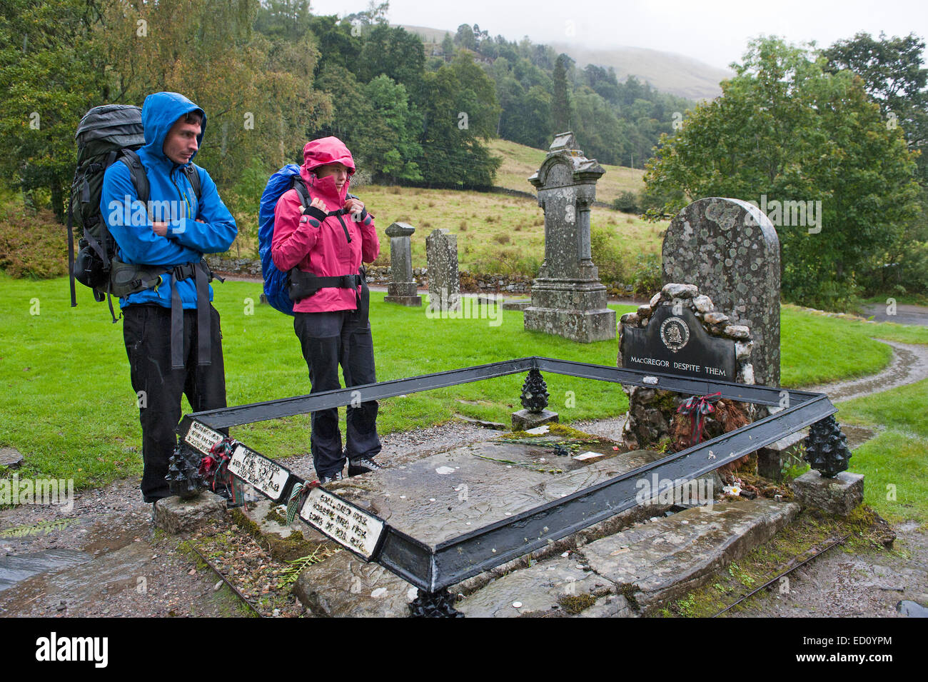 Hikers visiting Rob Roy's Grave Stock Photo