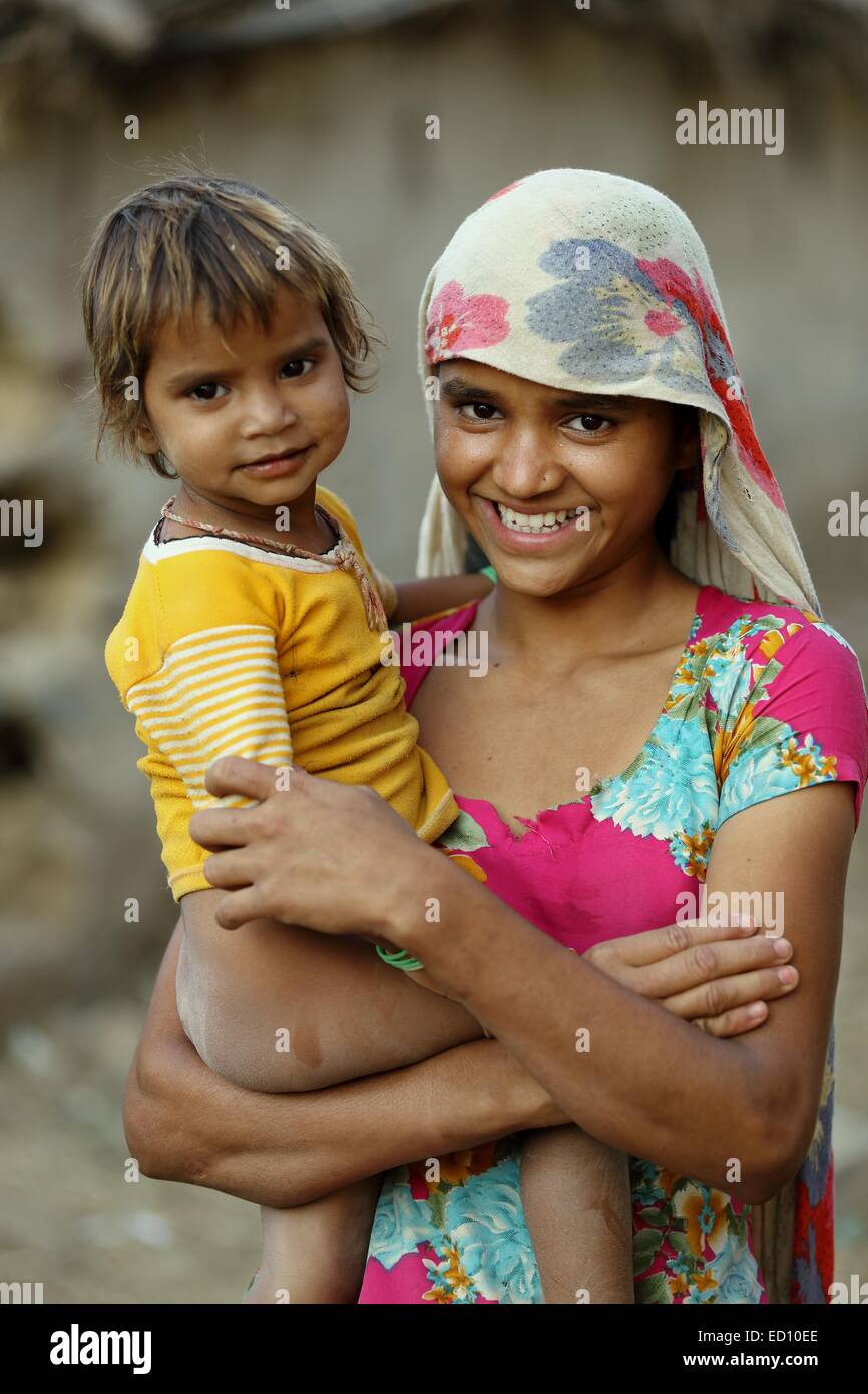Indian girl holding her little brother India Stock Photo