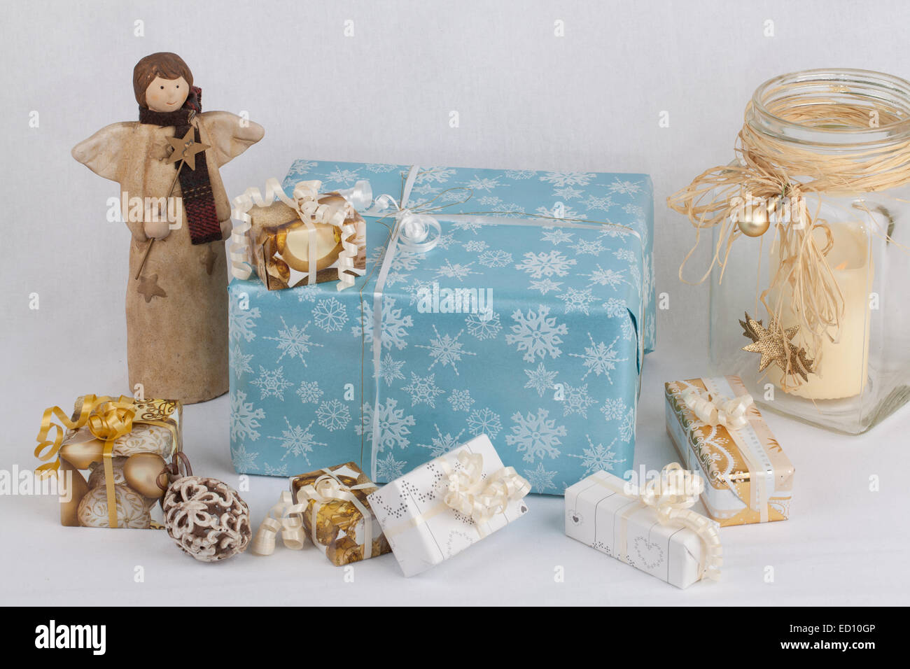 Christmas gifts beside an angel Stock Photo