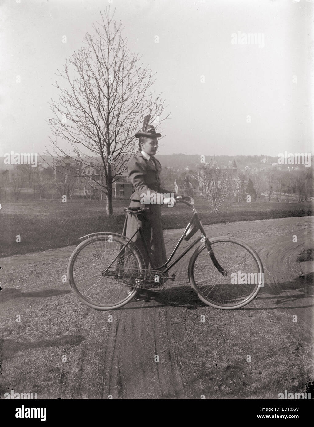 Antique, circa 1901 image, woman with a bicycle near Boston, Massachusetts, USA. Stock Photo