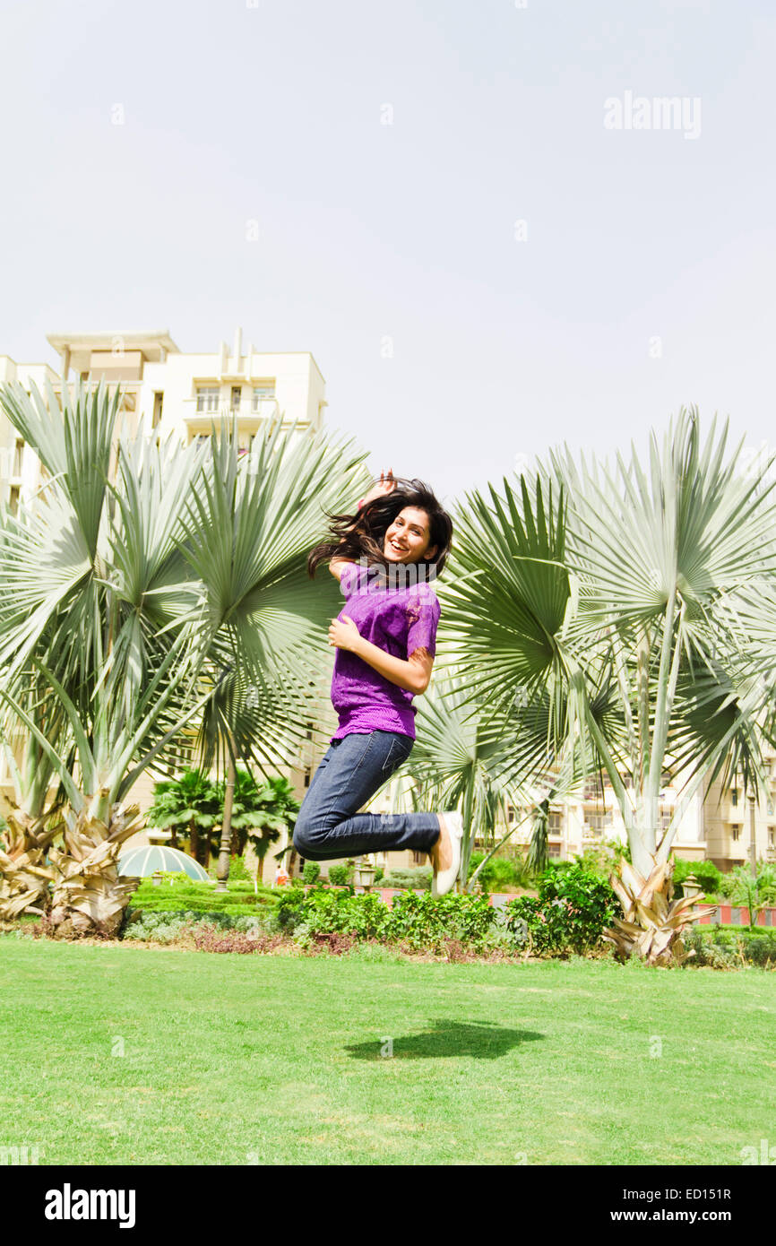 1 indian lady park jump Stock Photo