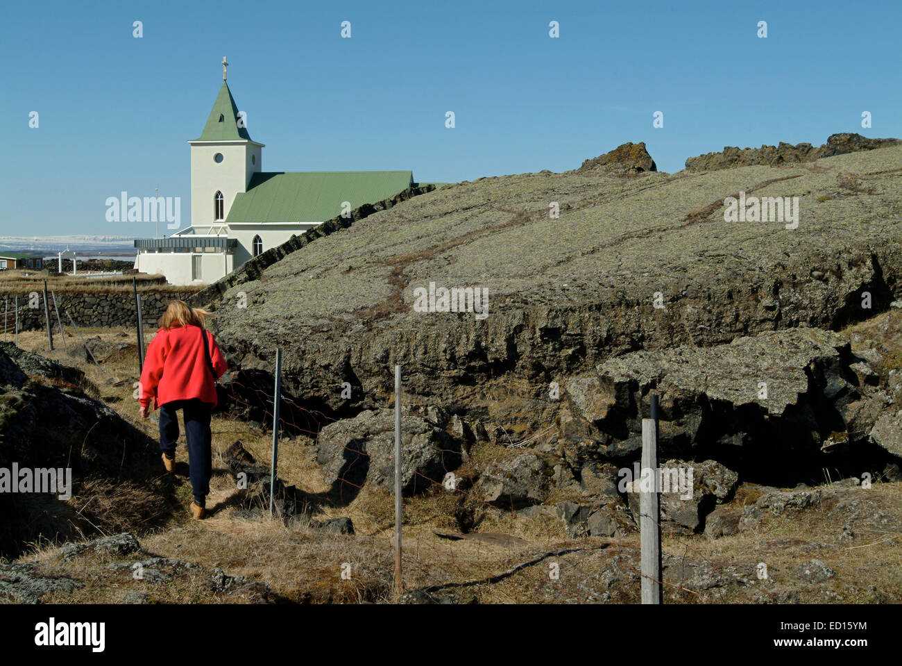 Lake Myvatn with church and lava floes in the adjoining village of Reykjahlid, Iceland. Stock Photo