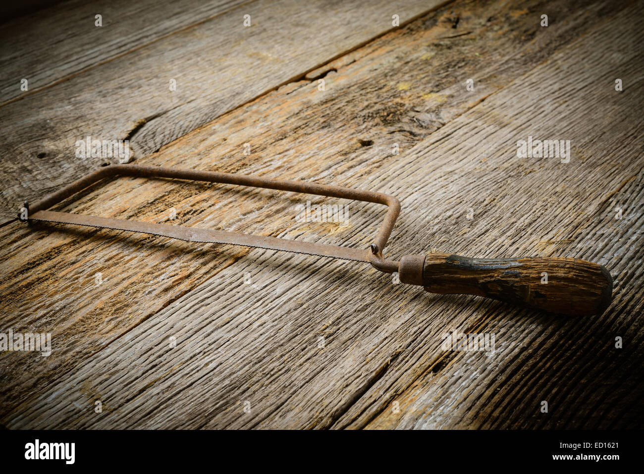 Hand Saw on Rustic Wood Background Stock Photo - Alamy