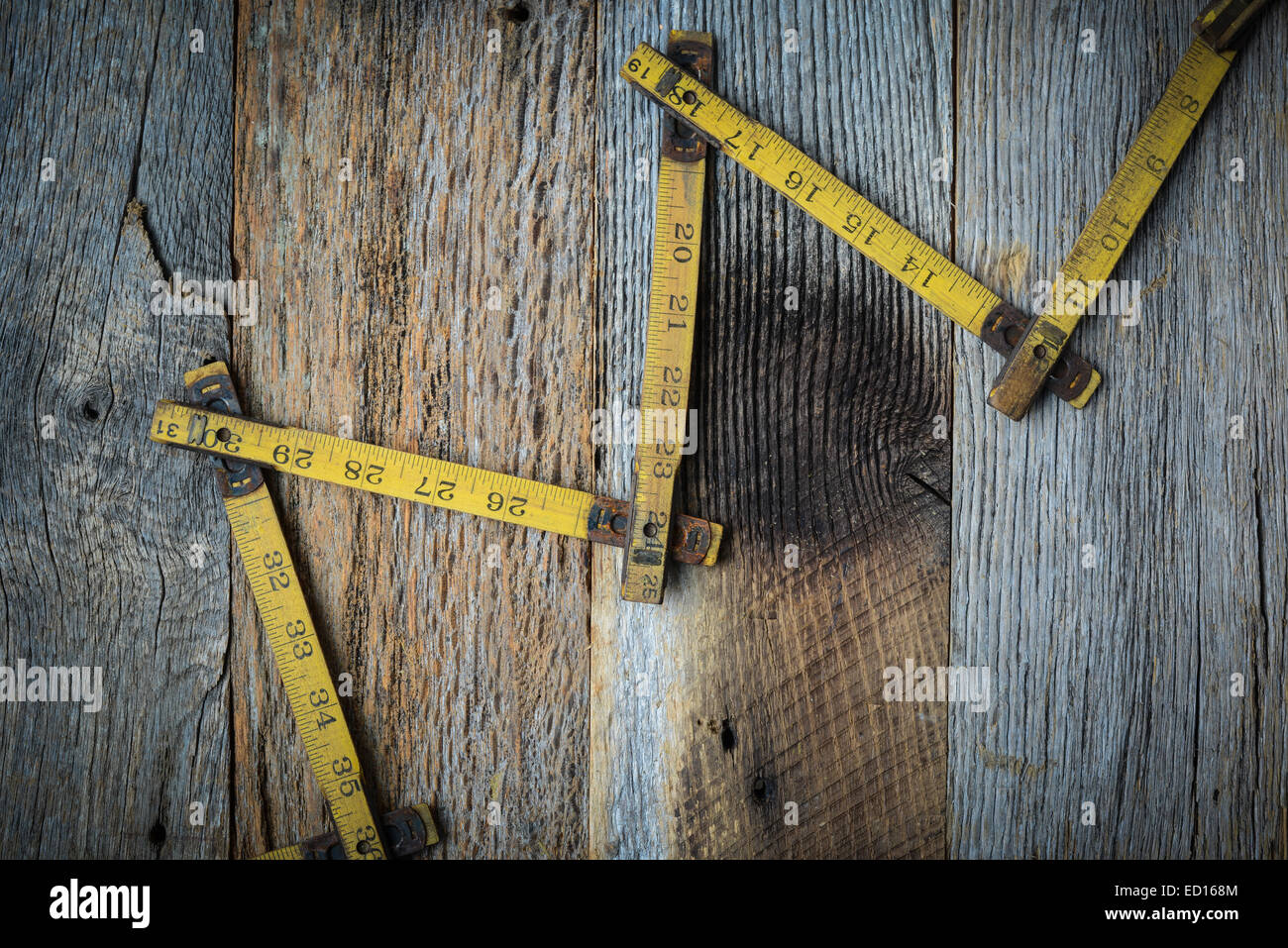 Old Tape Measure on Rustic Wood Background Stock Photo