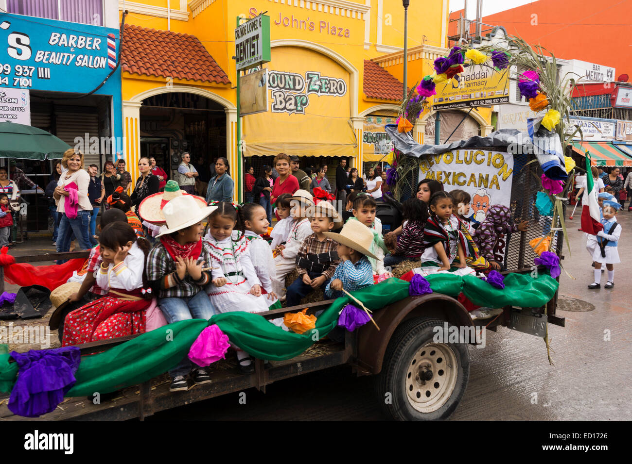 Children ride on a parade trailer in Nuevo Progreso to celebrate Mexican Independence Day. Stock Photo