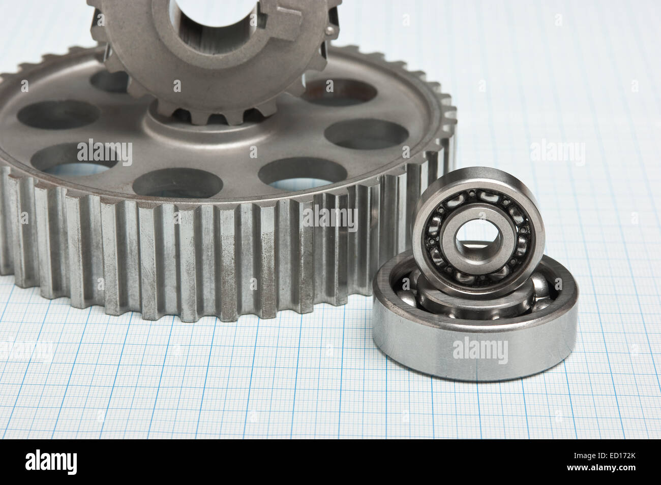 gears and bearings on graph paper Stock Photo Alamy