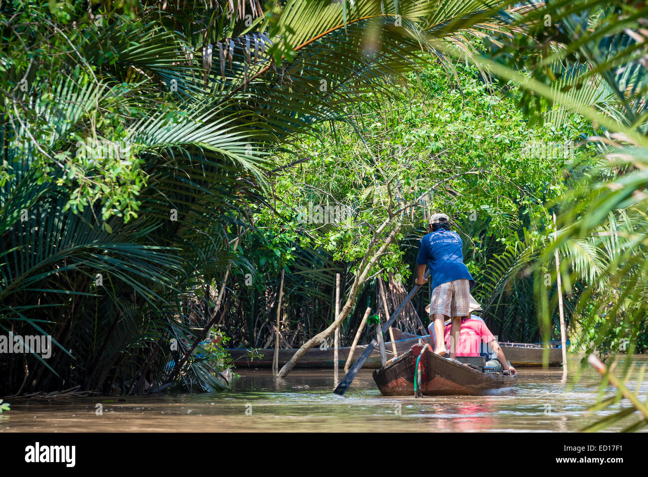 Traditional Vietnamese boat on river in Mekong Delta Stock Photo - Alamy