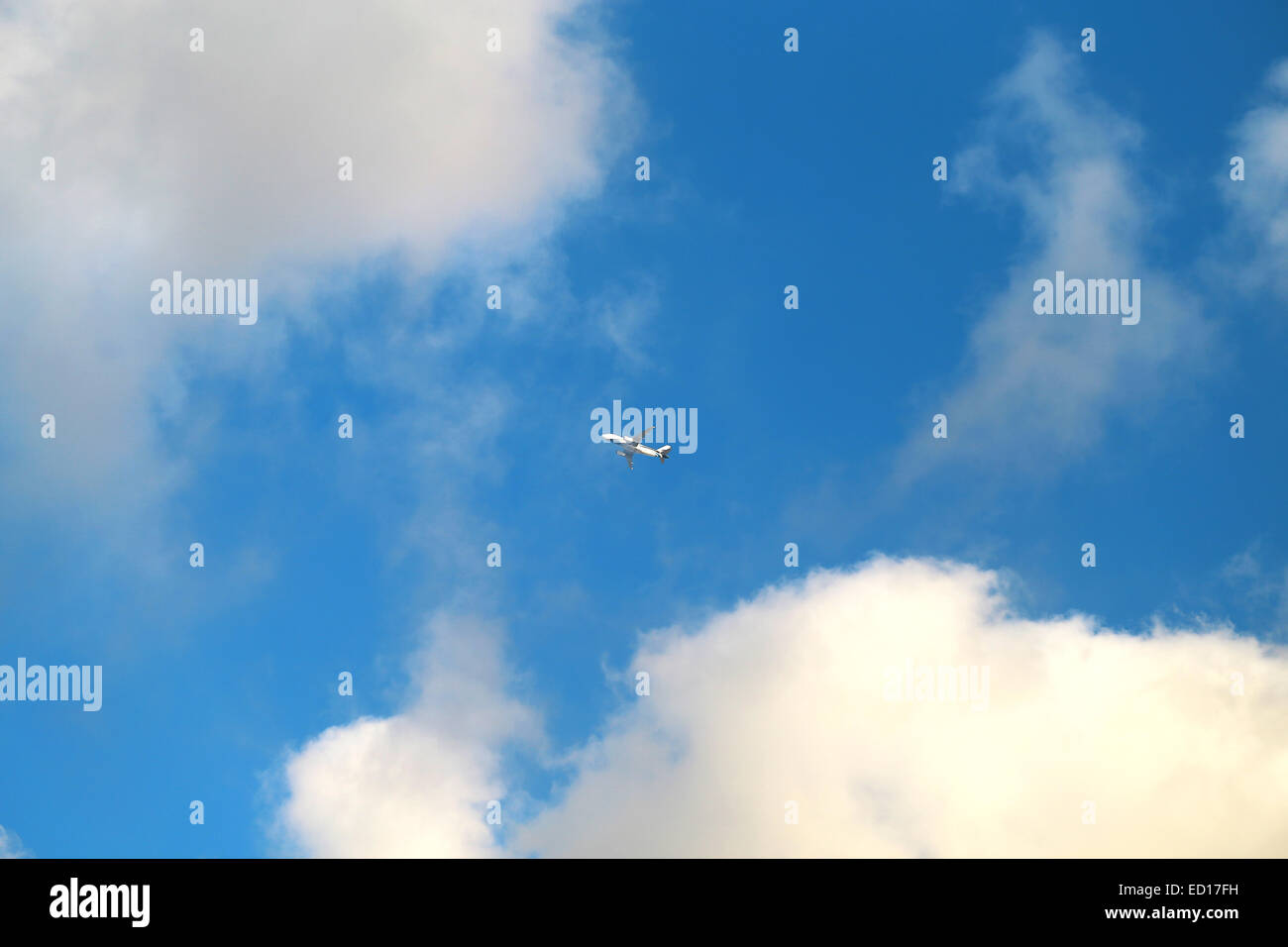 photo bright sky with clouds and aircraft Stock Photo