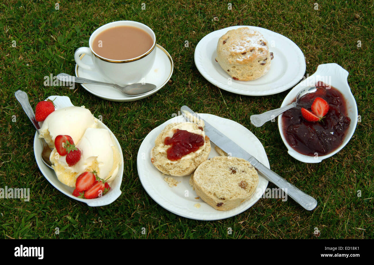 Cream tea with sandwiches, scones, cream, jam and cakes Stock Photo - Alamy