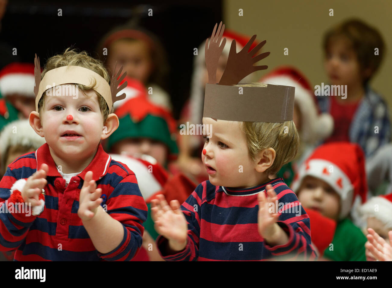 Pre-school children singing at the daycare Christmas show Stock Photo