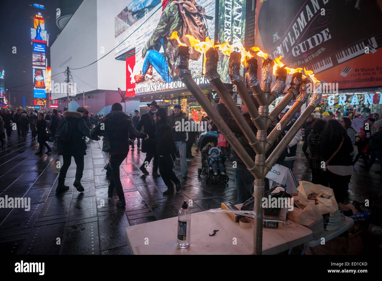 New York, USA. 23rd Dec, 2014. Lubavitcher Jewish young adults from Lubavitcher World Headquarters in Brooklyn celebrate the last night of Hanukkah, the Festival of Lights, in Times Square in New York on Tuesday, December 23, 2014. An oil-fueled menorah was lit accompanied by singing and dancing.   Credit:  Richard B. Levine/Alamy Live News) Stock Photo