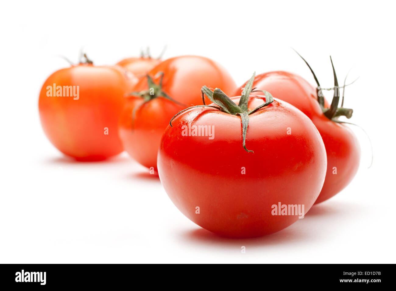 Tomatoes isolated on white background Stock Photo - Alamy
