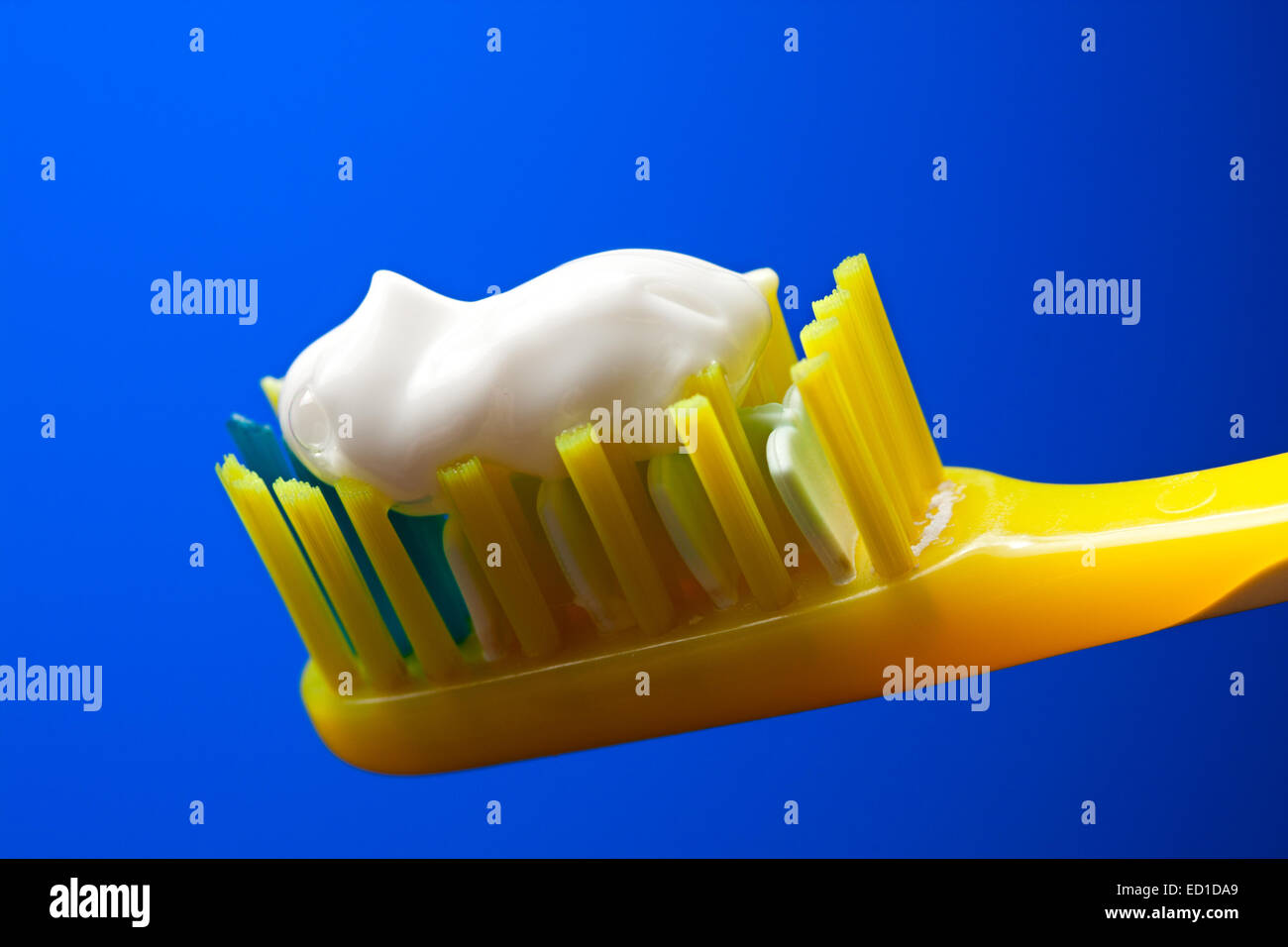 Toothbrush and toothpaste on a blue background Stock Photo Alamy